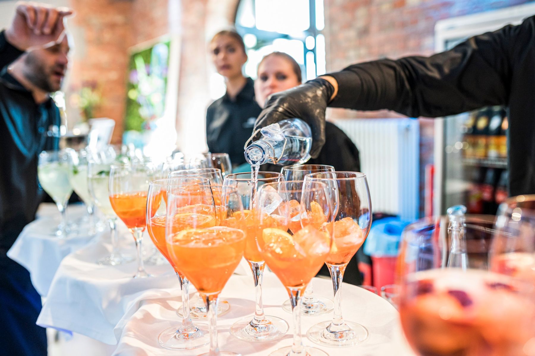 Aperol drinks being poured at the bar